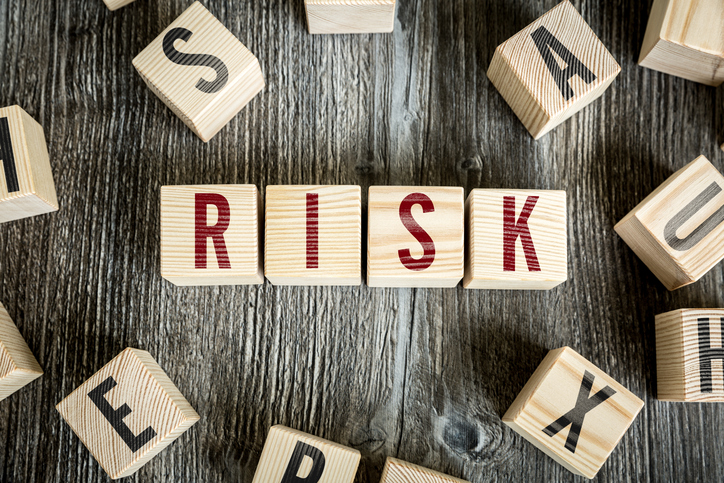 Wooden Blocks with the text: Risk